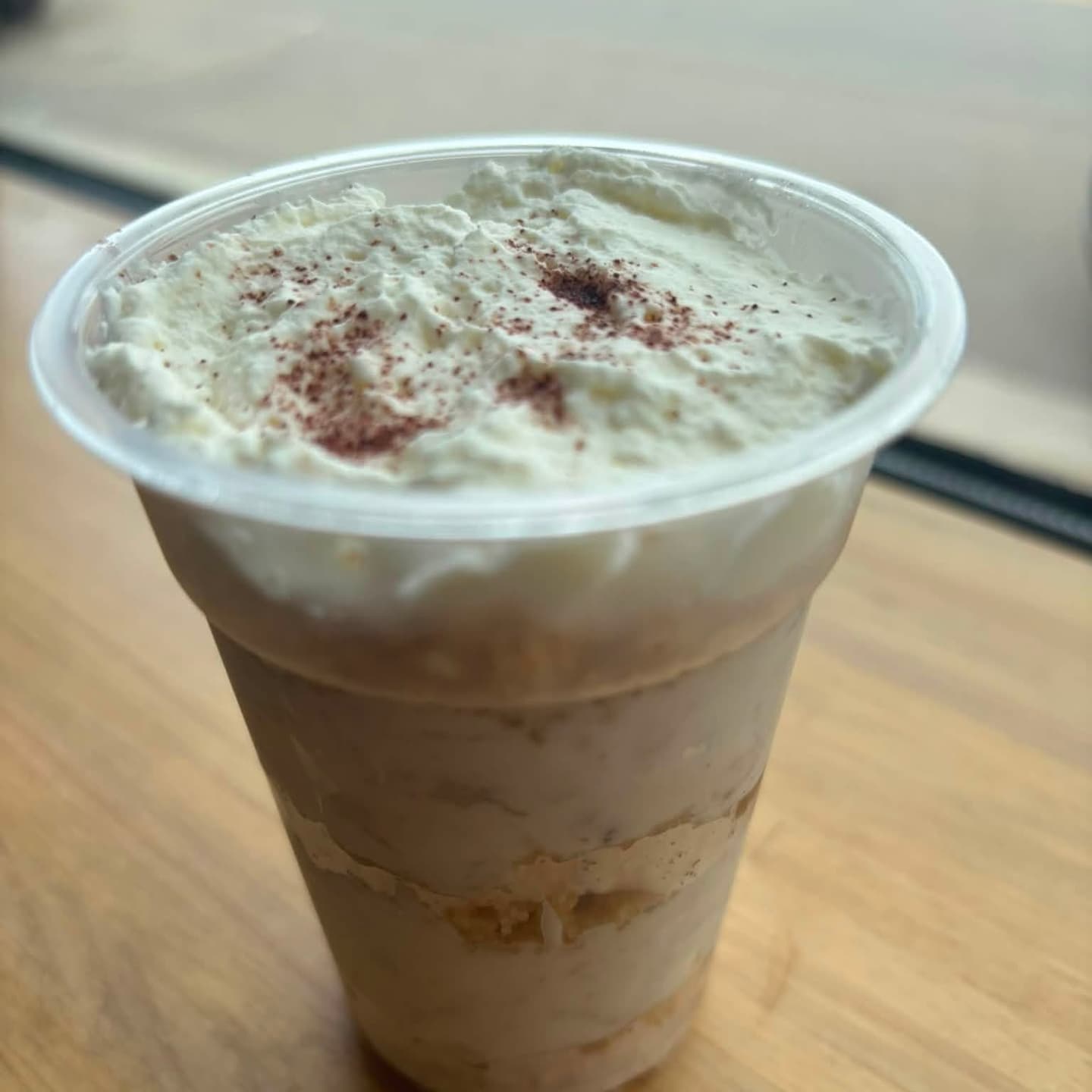 Iced coffee topped with whipped cream