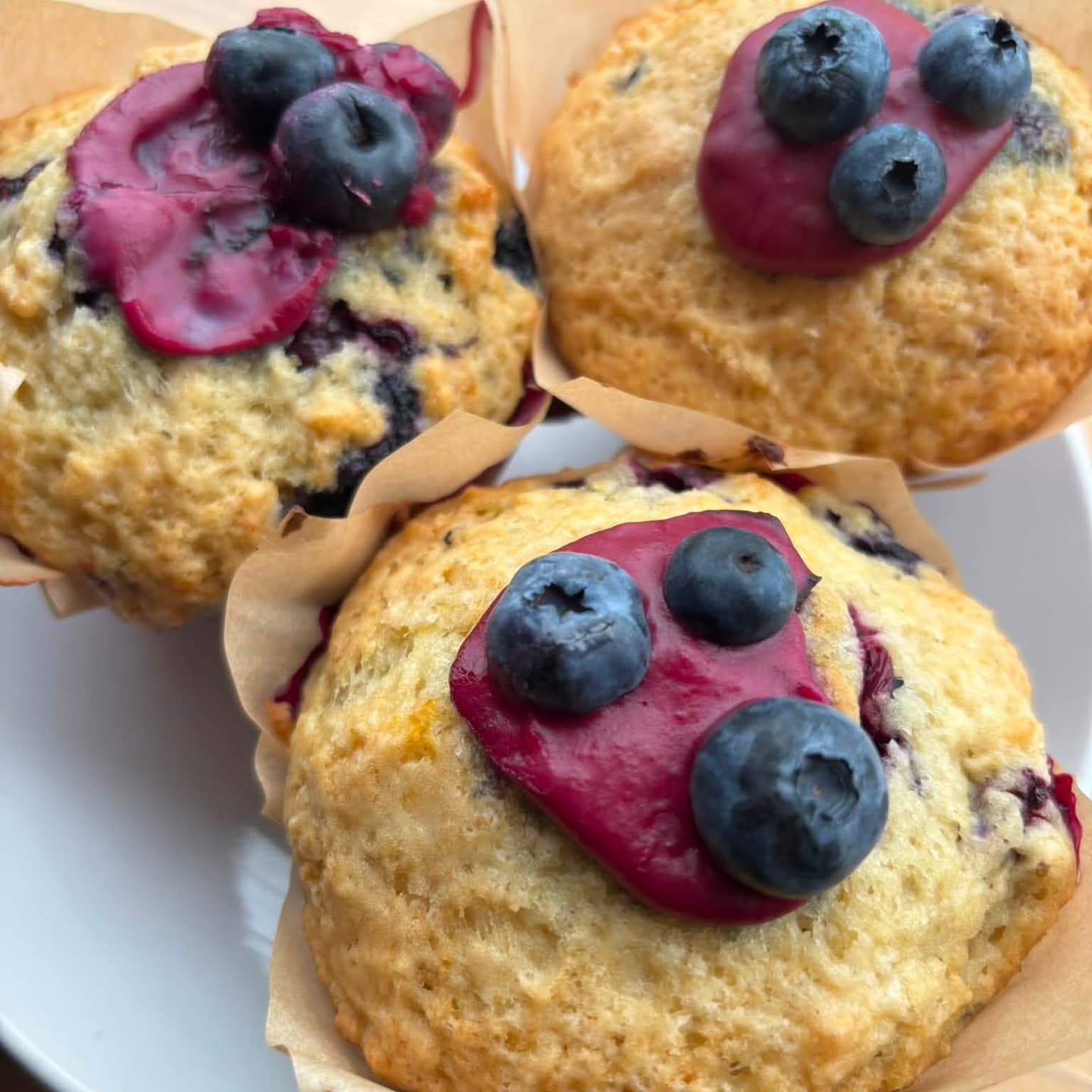 Blueberry muffins with berry glaze