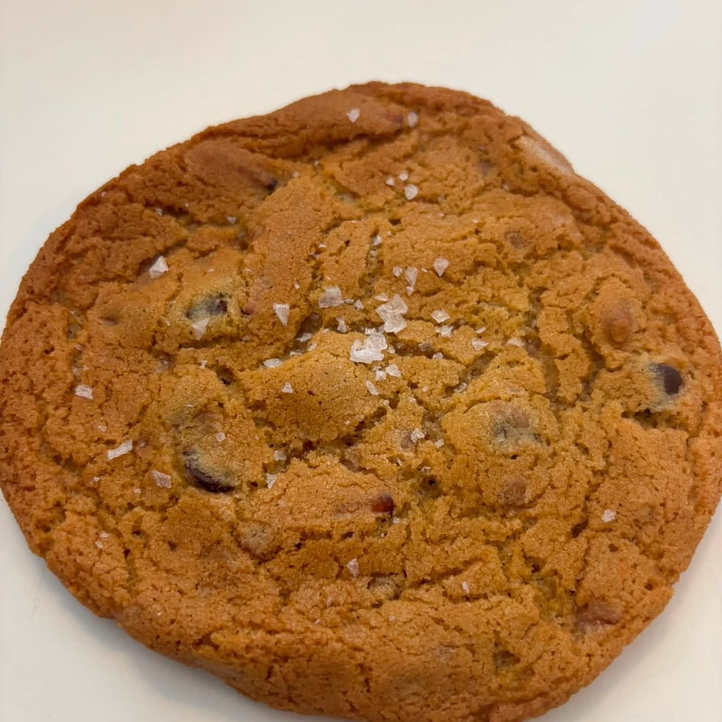 Golden chocolate chip cookies with flaky sea salt