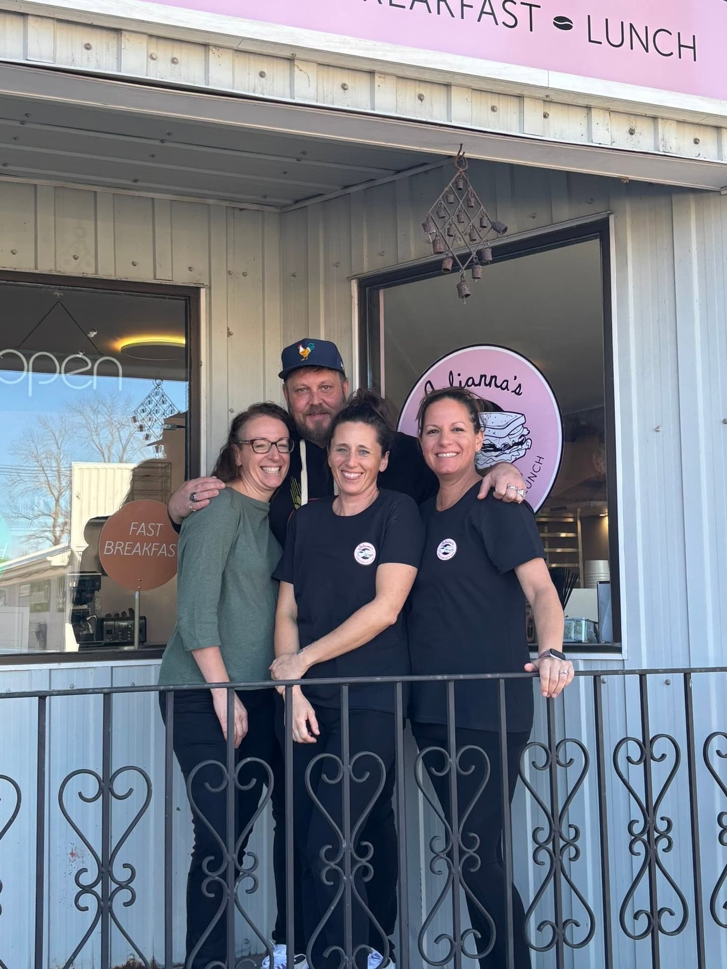 The Julianna’s team smiling in front of the shop on Main Street